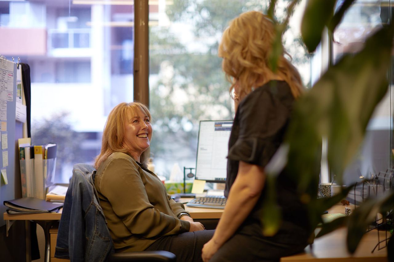 Two Solicitors In Their Central Coast (nsw) Office Conversing